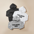 Three customizable hoodies with 'Your Design Here' text on a beige background